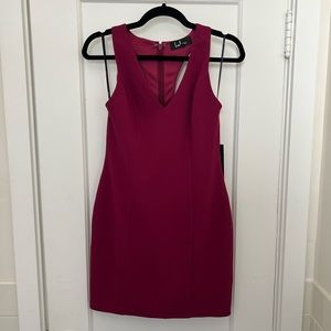 NEVER WORN - Purple body con dress with a T-back.